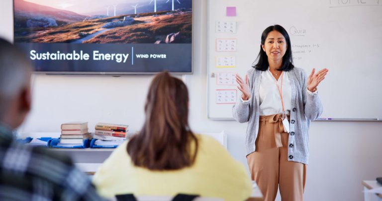 Professional trainer delivering CertifHy RFNBO training session in a classroom, making the programme accessible to Hydrogen Europe members and the wider hydrogen community under the CertifHy EU Voluntary Scheme